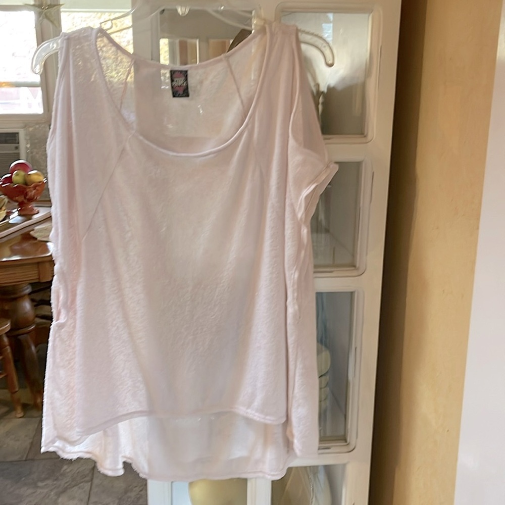 Medium Free People Light pink top with cold shoulder sleeve or slit sleeve.
